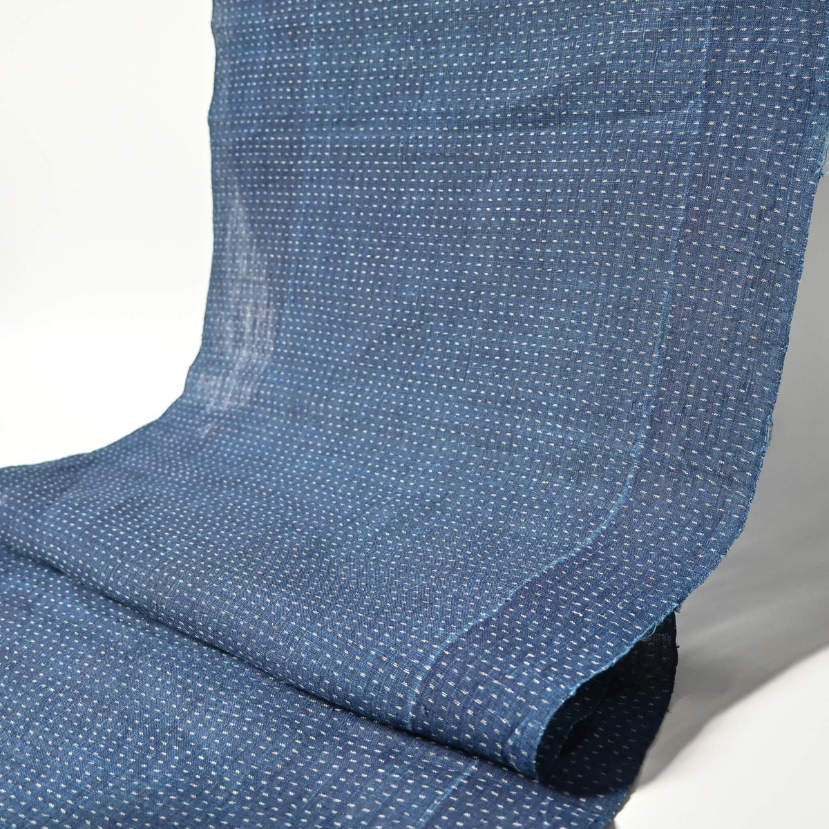 Full view of antique indigo kasuri hemp fabric piece from undone kimono, early 20th century.