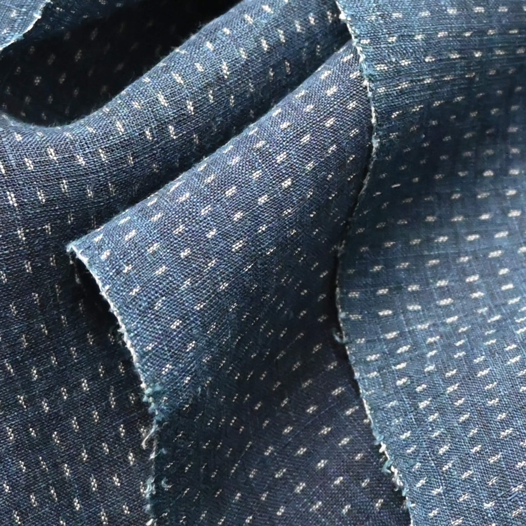 Close-up view of antique indigo kasuri hemp fabric piece from undone kimono, early 20th century.