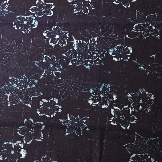 Close-up view of antique indigo katazome stencil dyed cotton with cherry blossom and maple leaf motifs, early 20th century.