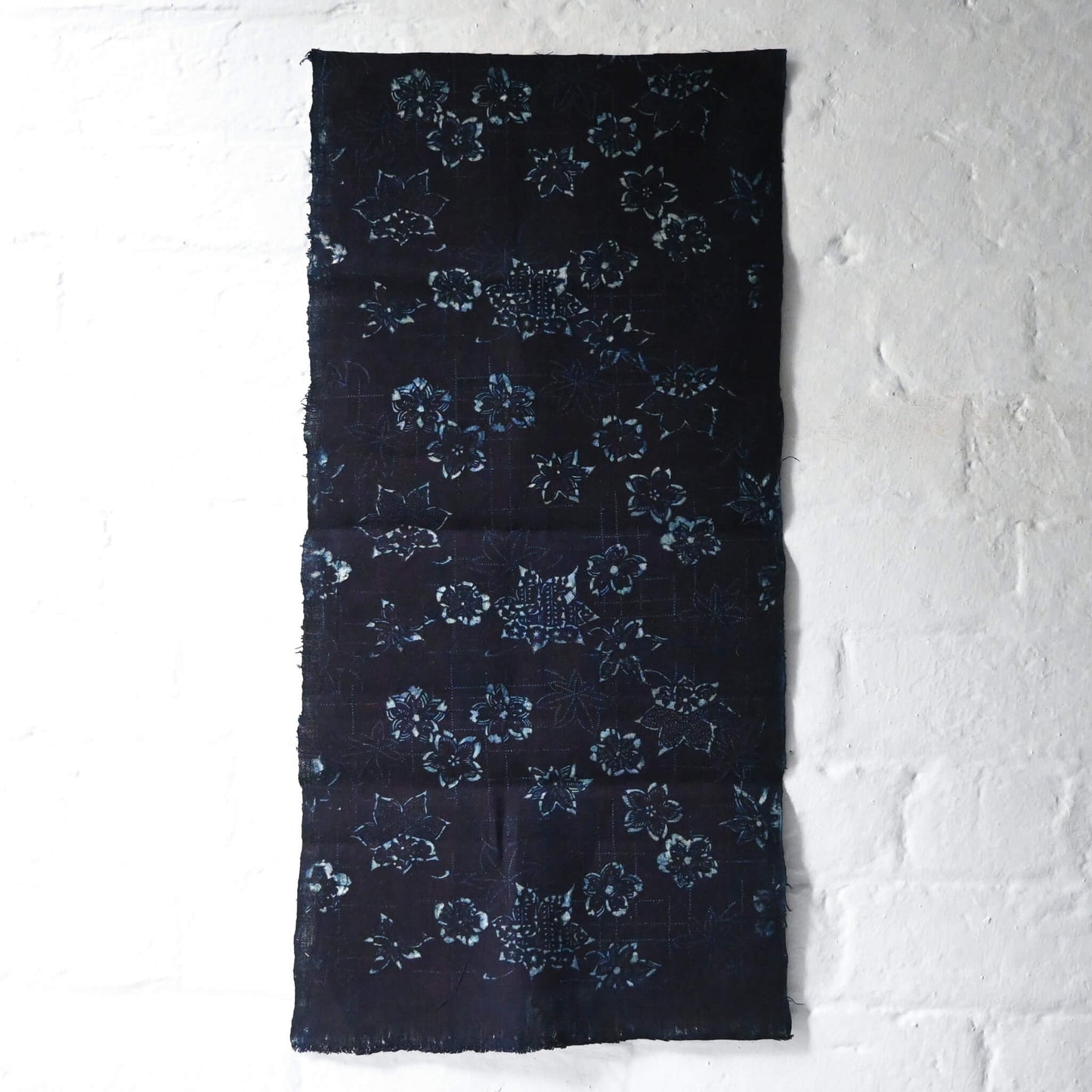 Full view of antique indigo katazome stencil dyed cotton with cherry blossom and maple leaf motifs, early 20th century.