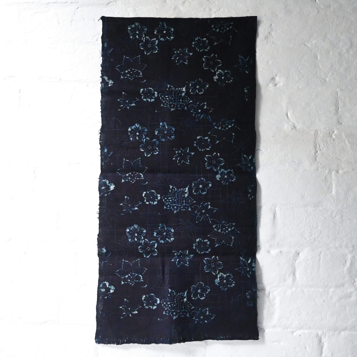 Full view of antique indigo katazome stencil dyed cotton with cherry blossom and maple leaf motifs, early 20th century.