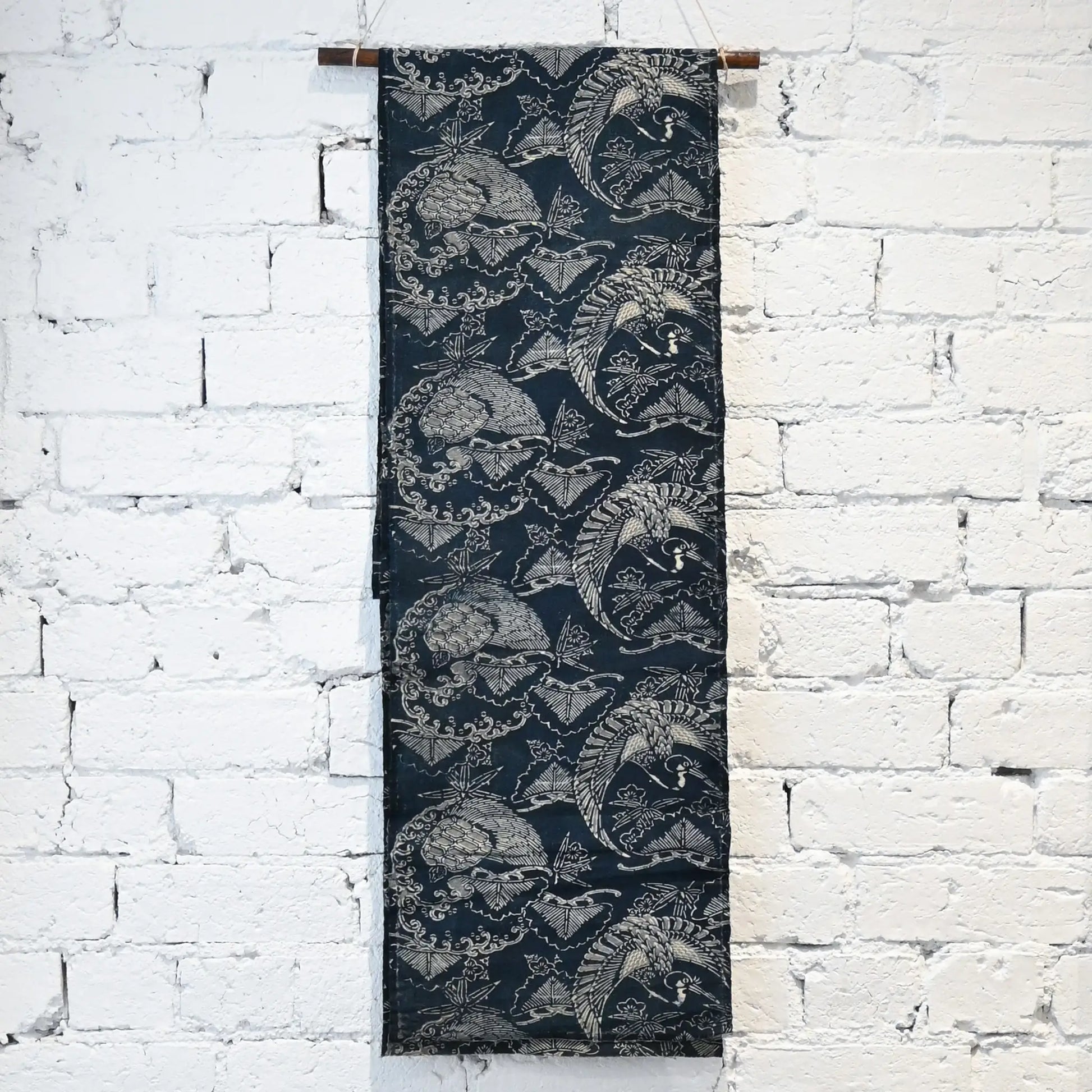 Hanging view of antique indigo Katazome dyed cotton with crane and tortoise form the early 20th century.