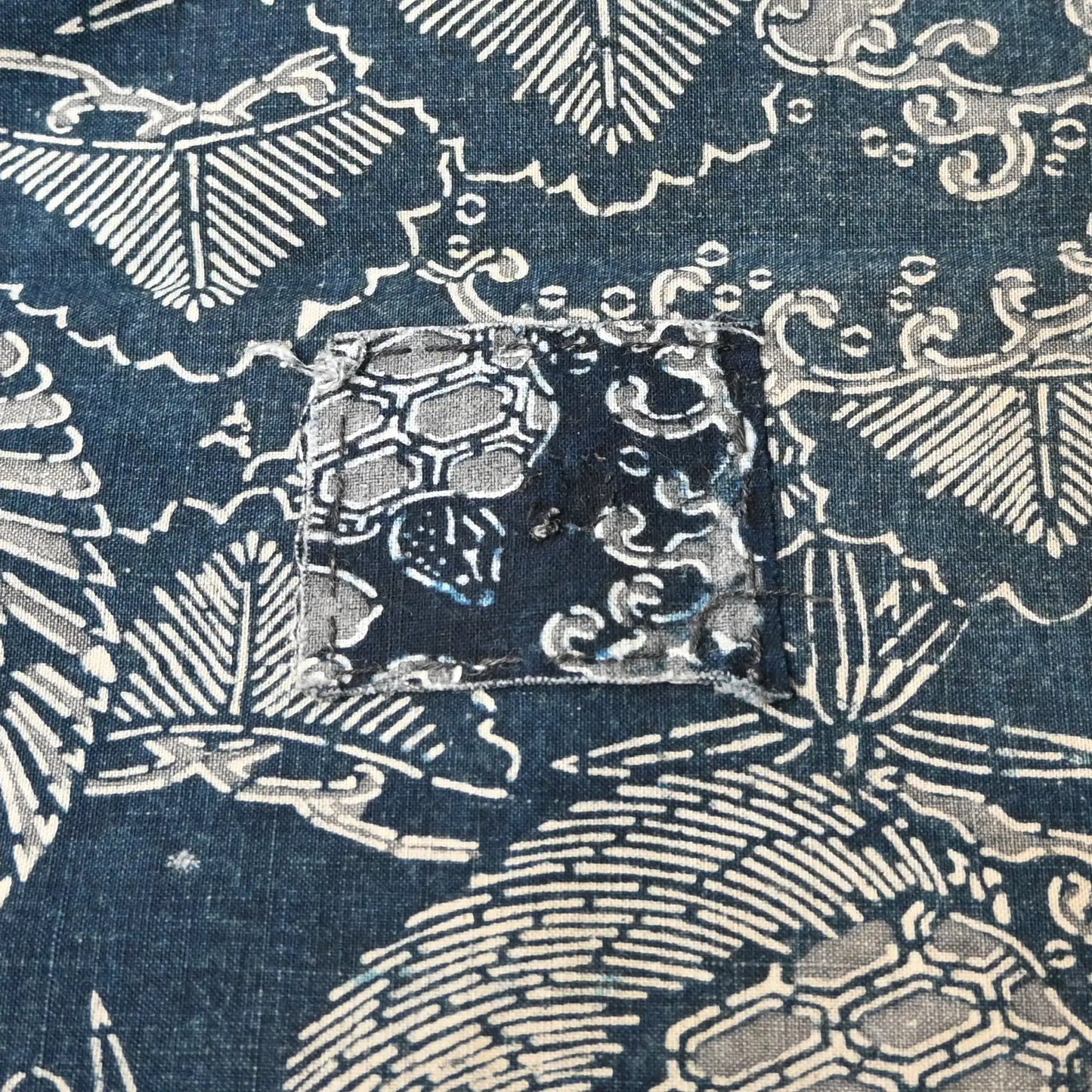 Detailed view of antique indigo Katazome dyed cotton with crane and tortoise form the early 20th century.