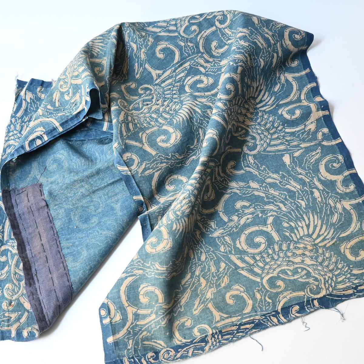 Full view of antique indigo katazome cotton with phoenix pattern from the early 20th century.