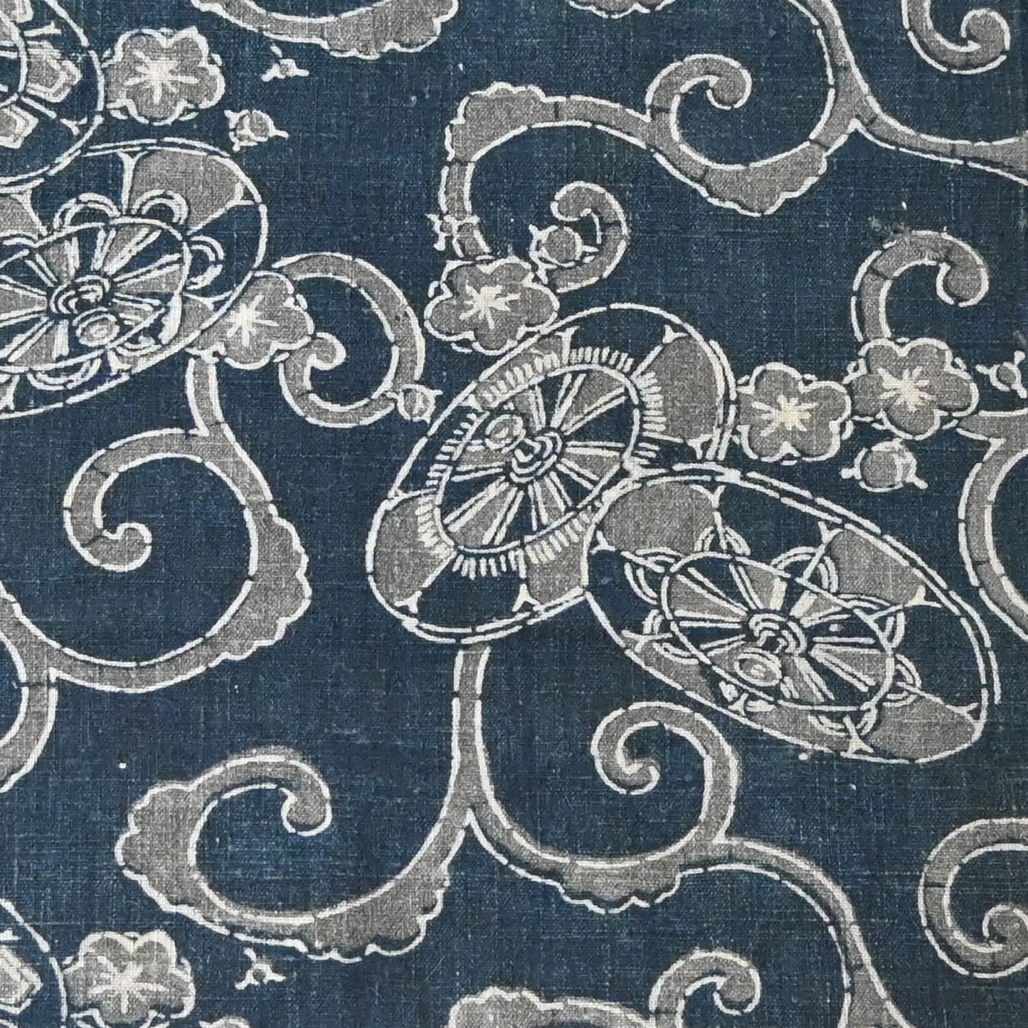 Antique indigo katazome cotton with wagasa and plum blossom motifs, from early 20th century.