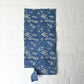 Hanging view of antique indigo katazome cotton with flowing wagasa (Japanese paper umbrellas) and cherry blossom motifs.