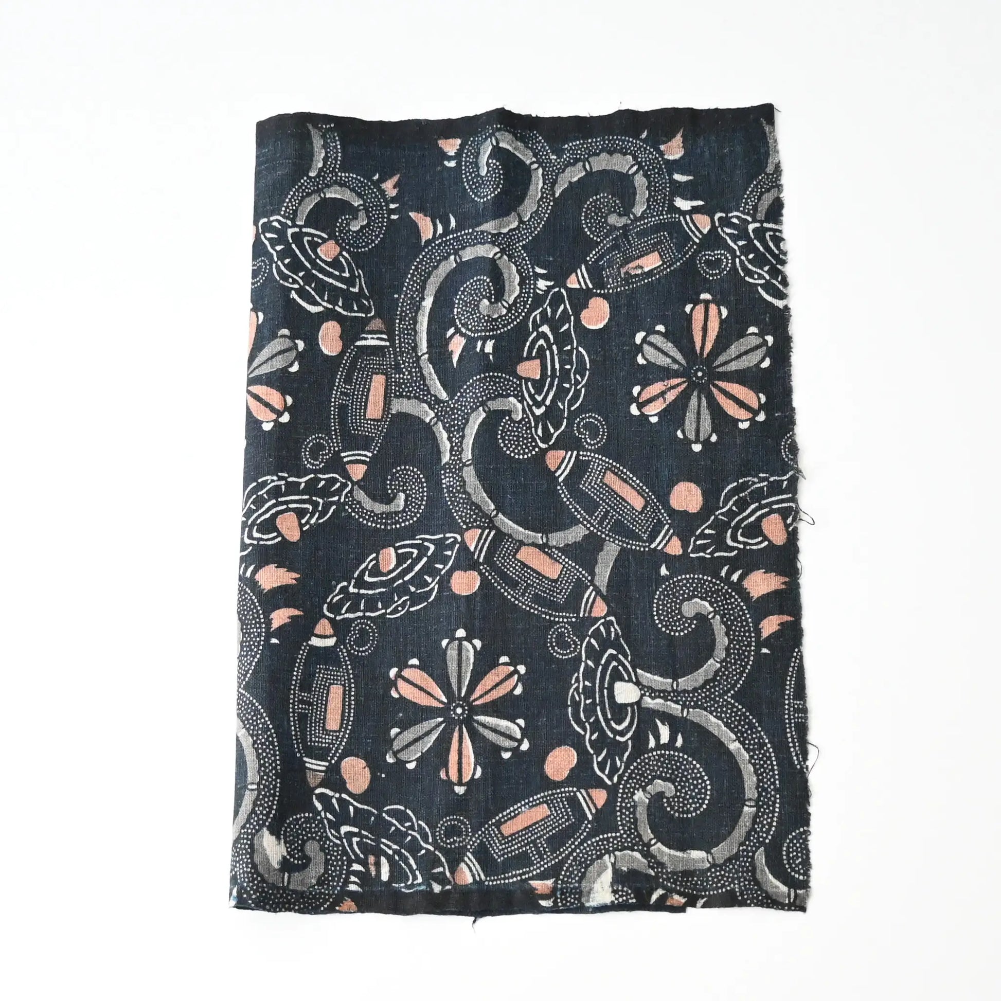 Antique indigo katazome dyed cotton piece with abstract floral motif, indigo with Bengala red and grey accents.