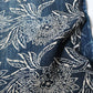 Detailed view of antique indigo katazome dyed cotton futon cover panel with chrysanthemum pattern.