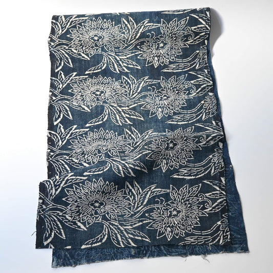 Full view of antique indigo katazome dyed cotton futon cover panel with chrysanthemum pattern.m