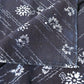 Close-up view of antique Japanese indigo katazome dyed cotton furoshiki, intricate dots and floral motifs.