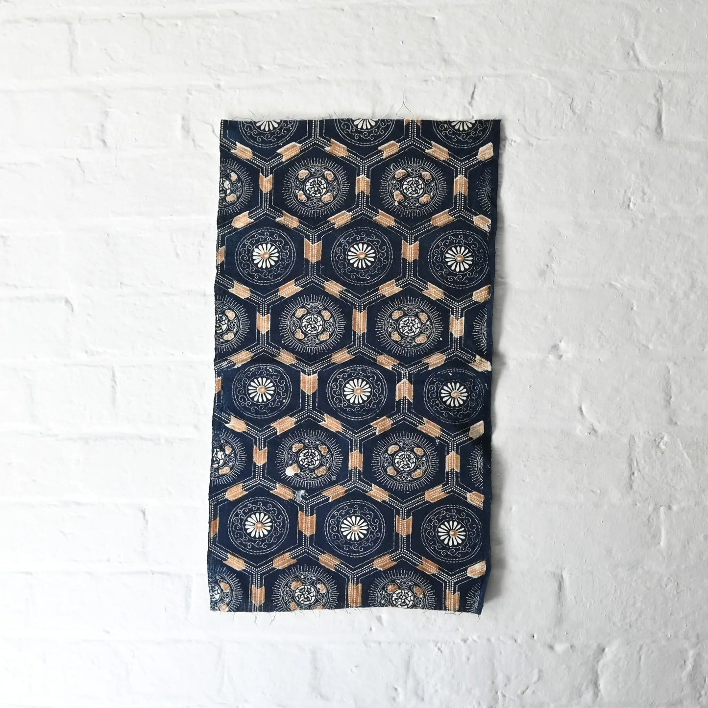 Full view of antique indigo katazome dyed cotton with bengala red accent, chrysanthemum and Kikko tortoiseshell pattern.