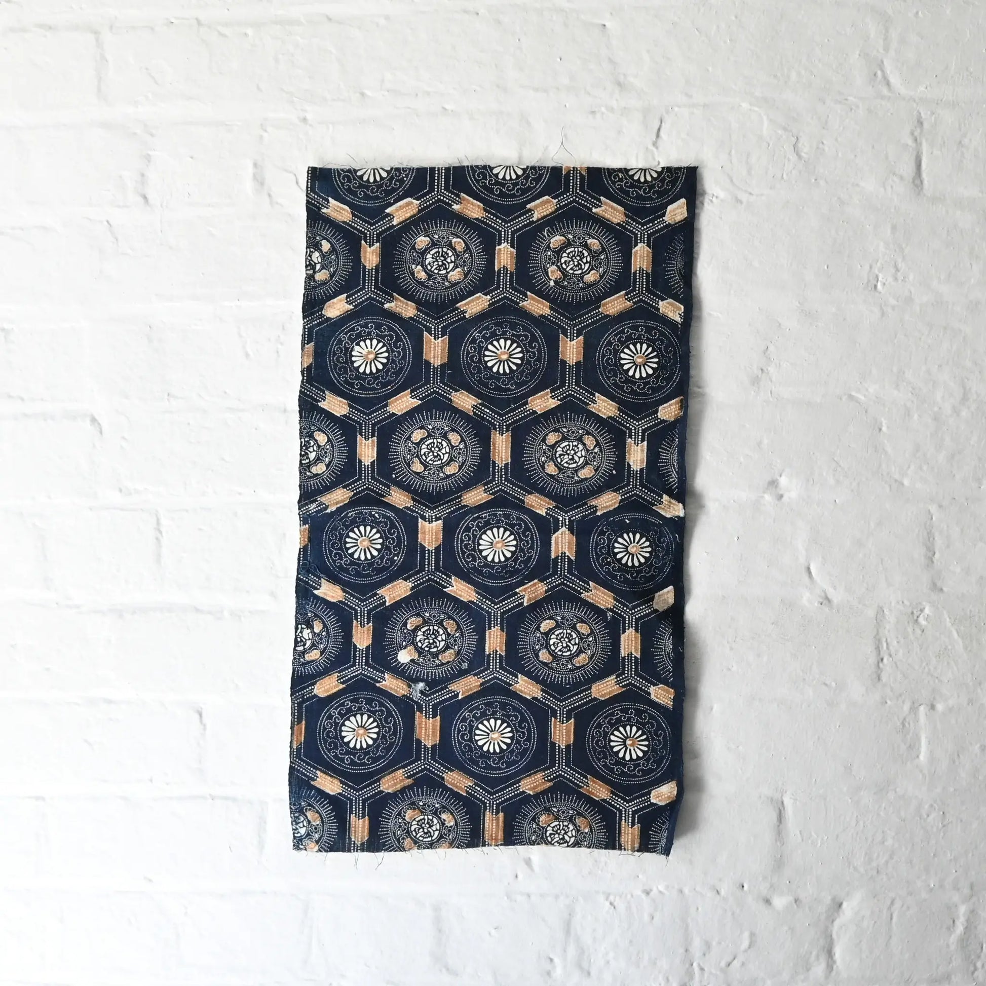 Full view of antique indigo katazome dyed cotton with bengala red accent, chrysanthemum and Kikko tortoiseshell pattern.