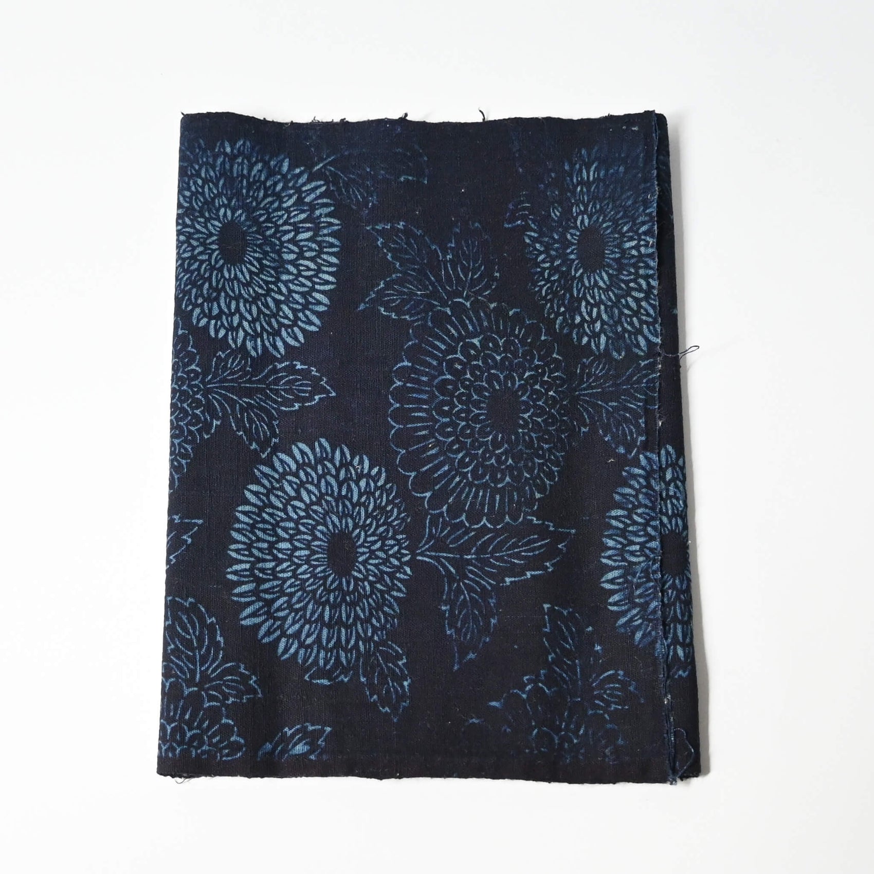 Antique indigo katazome dyed cotton futon cover panel with chrysanthemum motif.