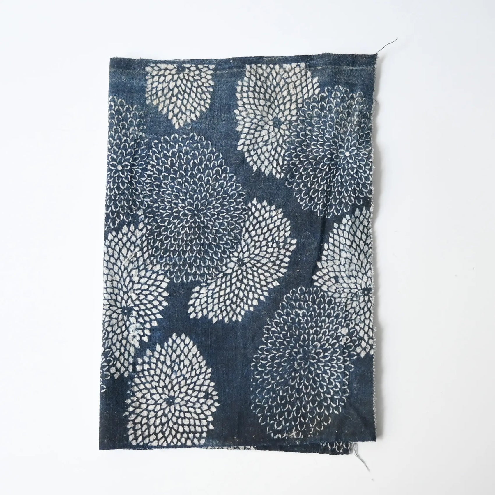 Antique indigo Katazome dyed cotton with chrysanthemum pattern from the early 20th century.