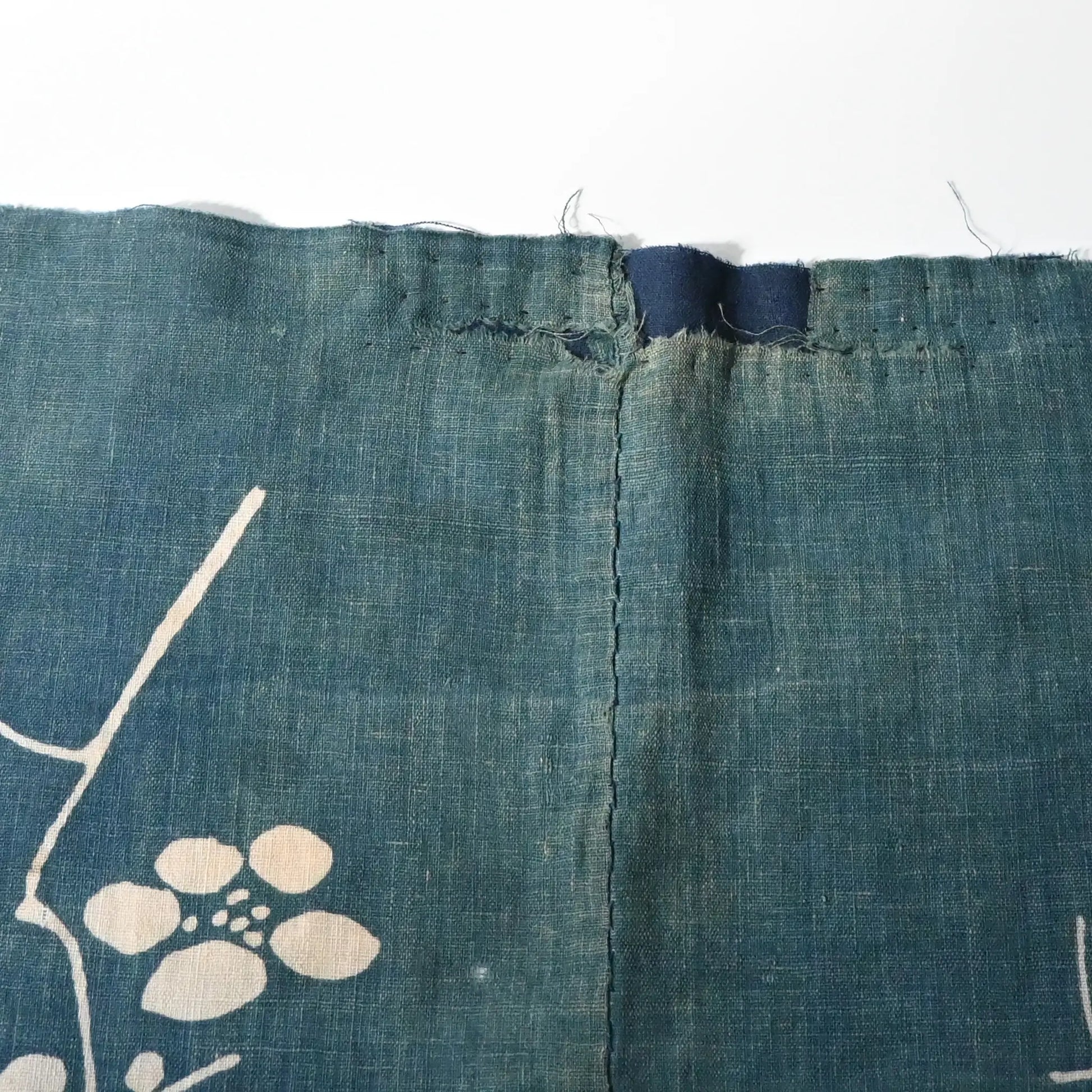 Detailed view of rare antique indigo tsutsugaki-dyed cotton futon cover with tea ceremony utensils motif. 