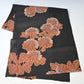 Full view of antique Japanese black lightweight fine silk kimono fabric with chrysanthemum motif.