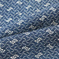 Detailed view of antique Japanese indigo katazome dyed cotton with intricate small pattern from the early 20th century.