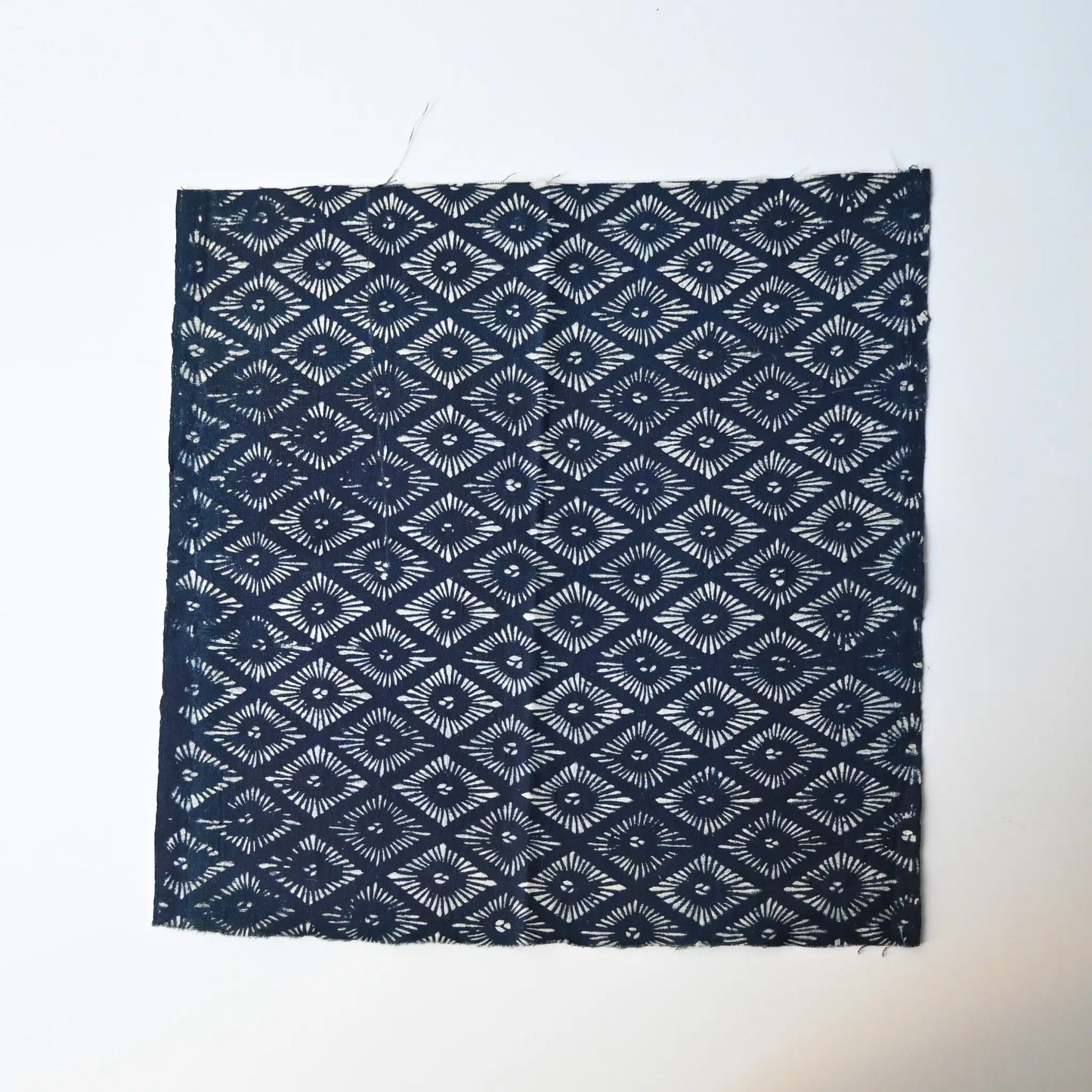 Antique indigo katazome dyed cotton with stylised chrysanthemum motif from the early 20th century.