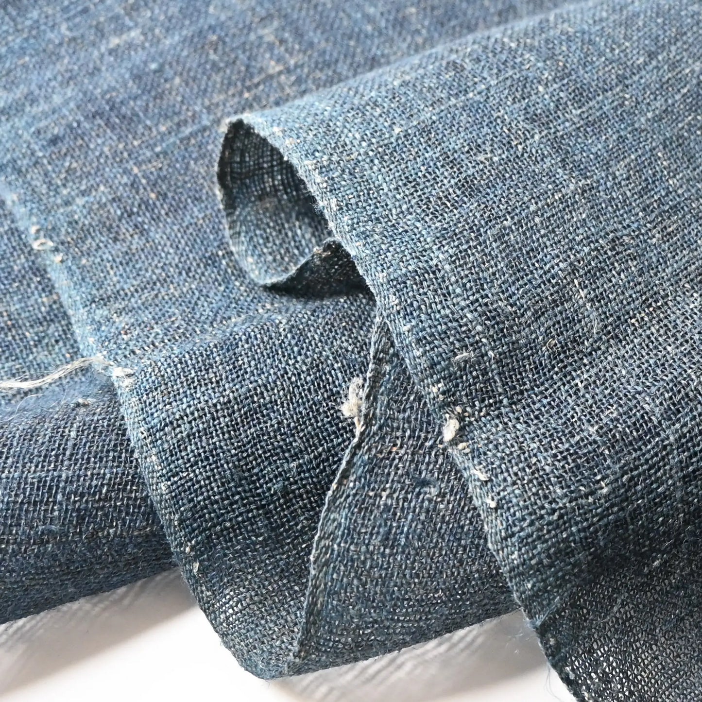 Detailed view of antique Japanese indigo dyed open-weave hemp Kaya panel from the early 20th century.