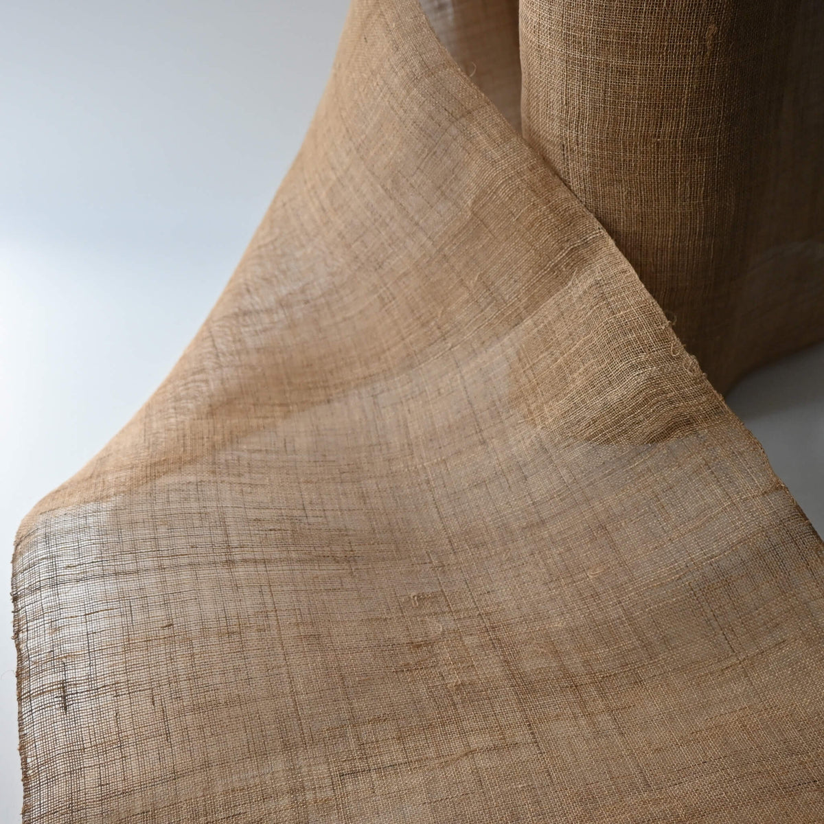 Close-up view of antique Japanese natural hemp sold by the metre, open weave and coarse.