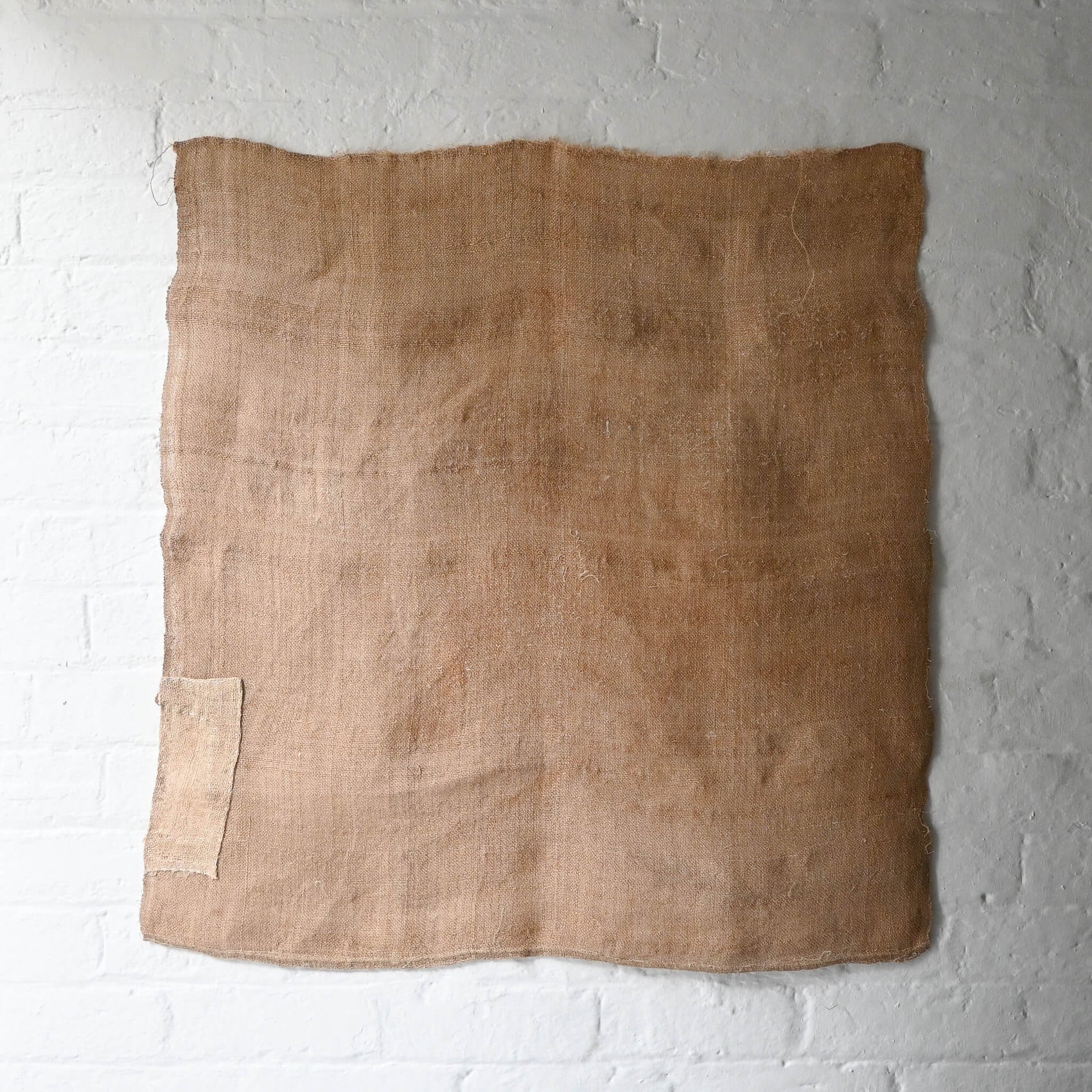 Full view of antique Japanese natural thick hemp with a patch, rustic feel.