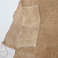Detailed view of antique Japanese natural thick hemp with a patch, rustic feel.