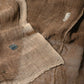 Detailed view of antique Japanese natural brown six-panel hemp mosquito net Kaya with beautiful mends.