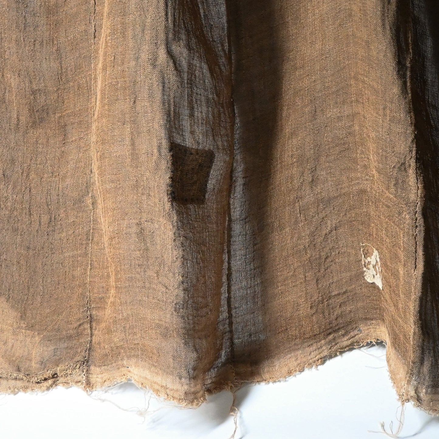 Detailed view of antique Japanese natural brown six-panel hemp mosquito net Kaya with beautiful mends.