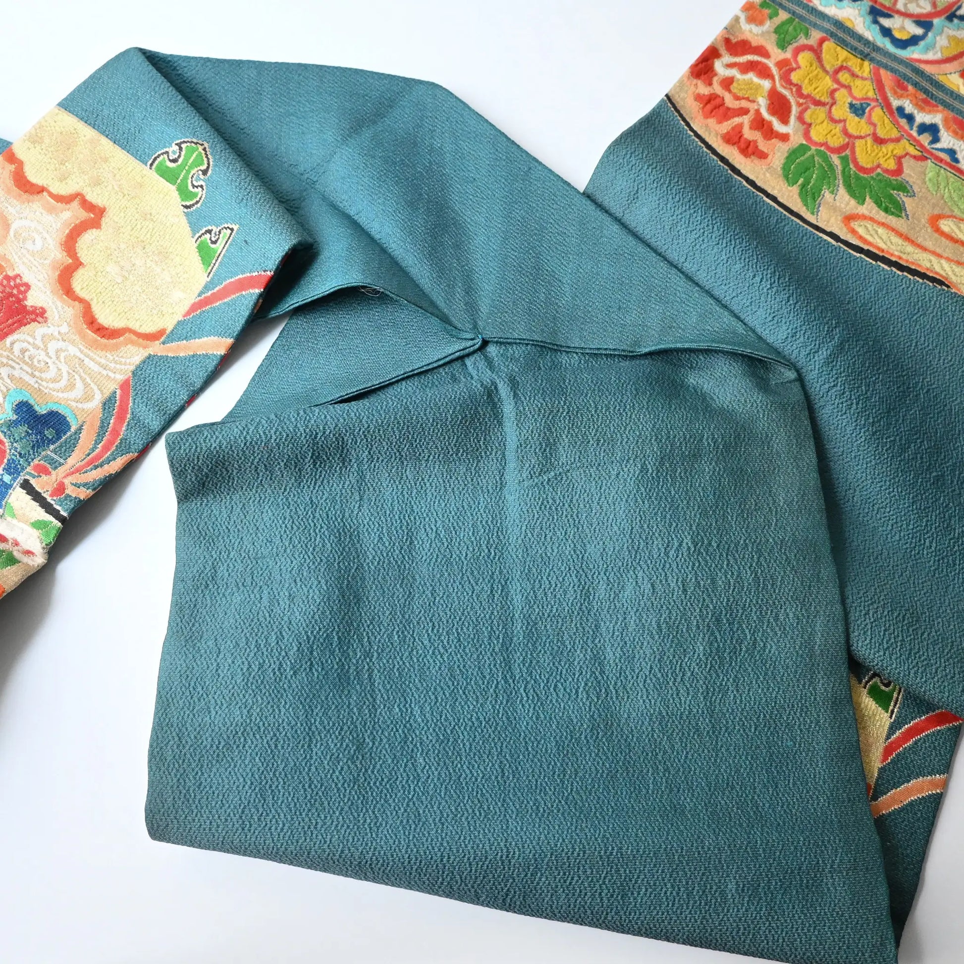 Detailed view of antique Japanese women's teal blue Nagoya obi with gorgeous fan and Kaioke motif from 1930-40s.