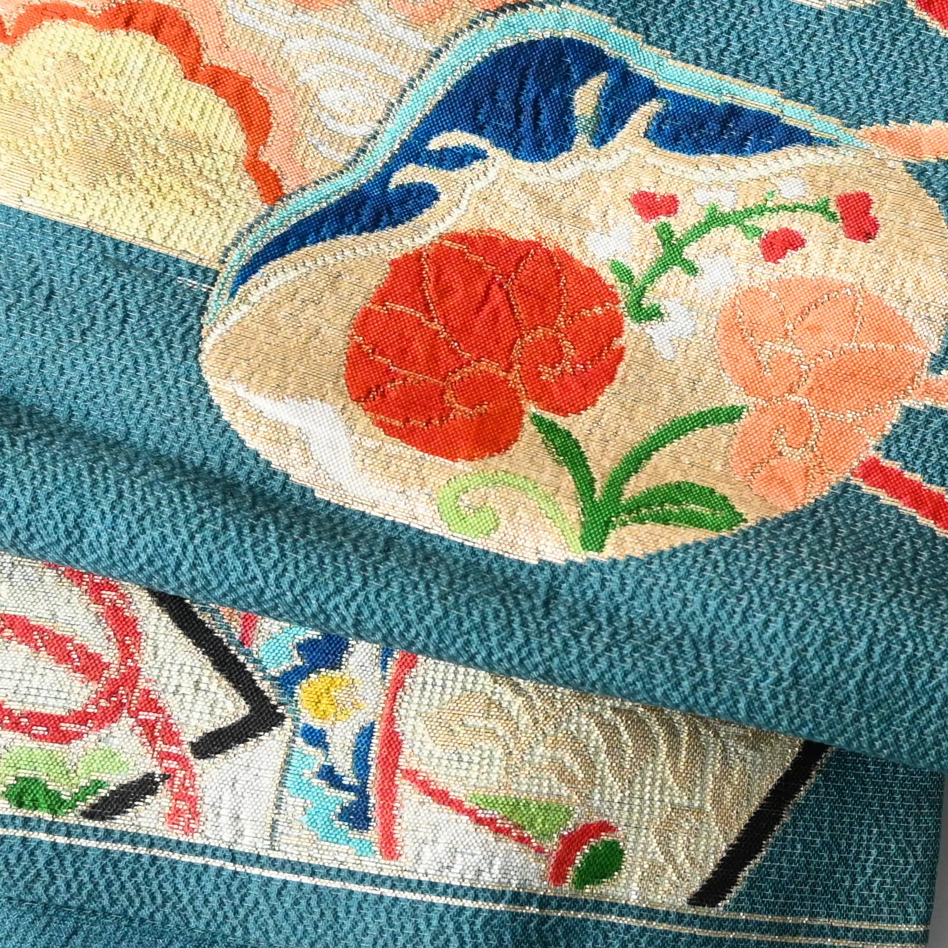 Detailed view of antique Japanese women's teal blue Nagoya obi with gorgeous fan and Kaioke motif from 1930-40s.