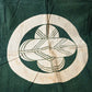 Antique indigo green cotton furoshiki with family crest mon from the early 20th century.