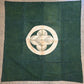 Full view of antique indigo green cotton furoshiki with family crest mon from the early 20th century.