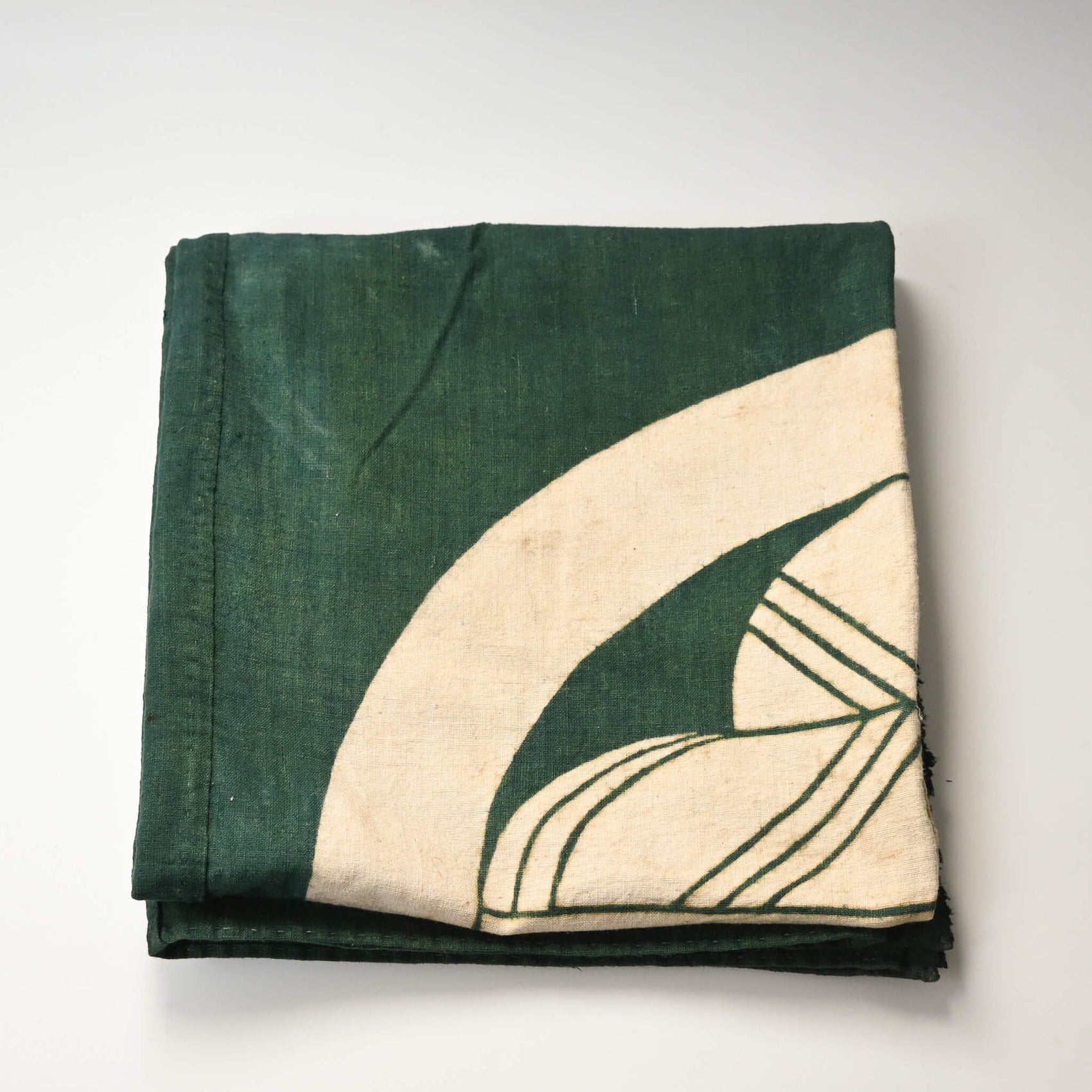 Antique indigo green cotton furoshiki with family crest mon from the early 20th century.