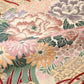 Detailed view of antique silk Maru obi with floral bouquet motif from the early 20th century.