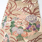 Antique silk Maru obi with floral bouquet motif from the early 20th century.