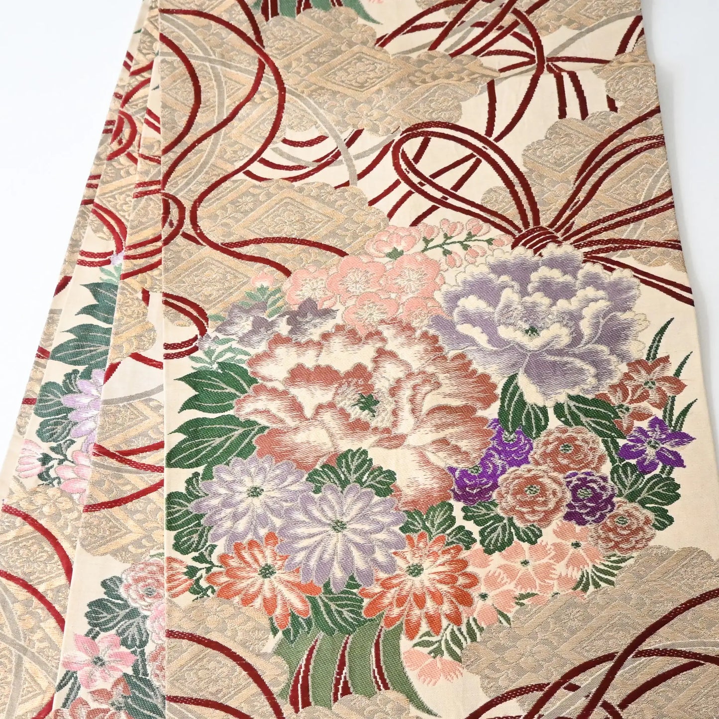 Antique silk Maru obi with floral bouquet motif from the early 20th century.