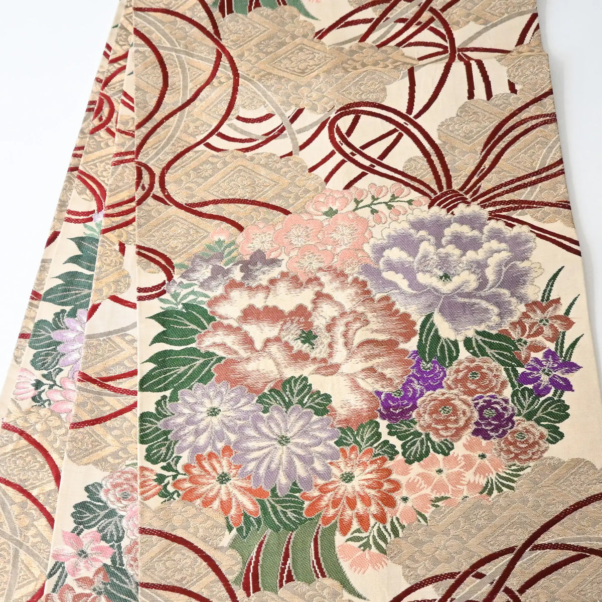 Antique silk Maru obi with floral bouquet motif from the early 20th century.