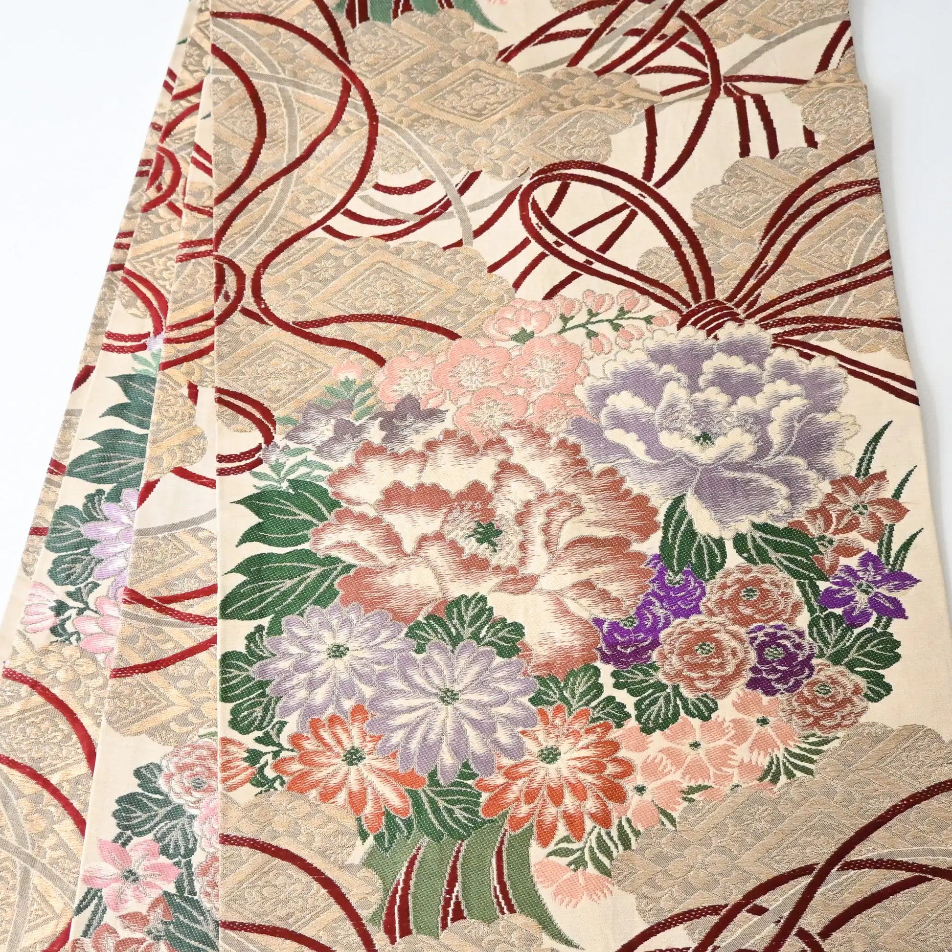 Antique silk Maru obi with floral bouquet motif from the early 20th century.