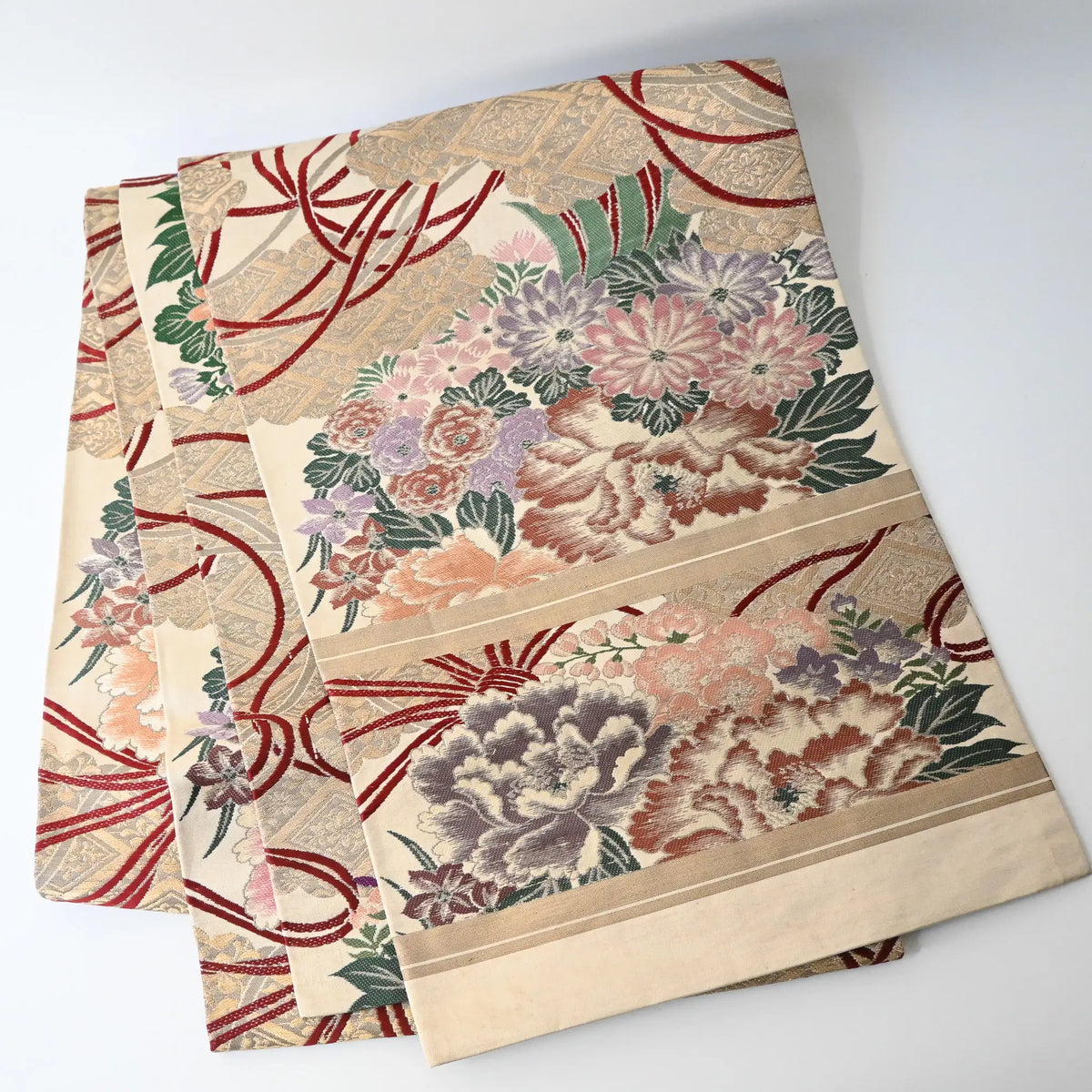 Antique silk Maru obi with floral bouquet motif from the early 20th century.