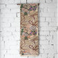 Hanging view of antique silk Maru obi with floral bouquet motif from the early 20th century.