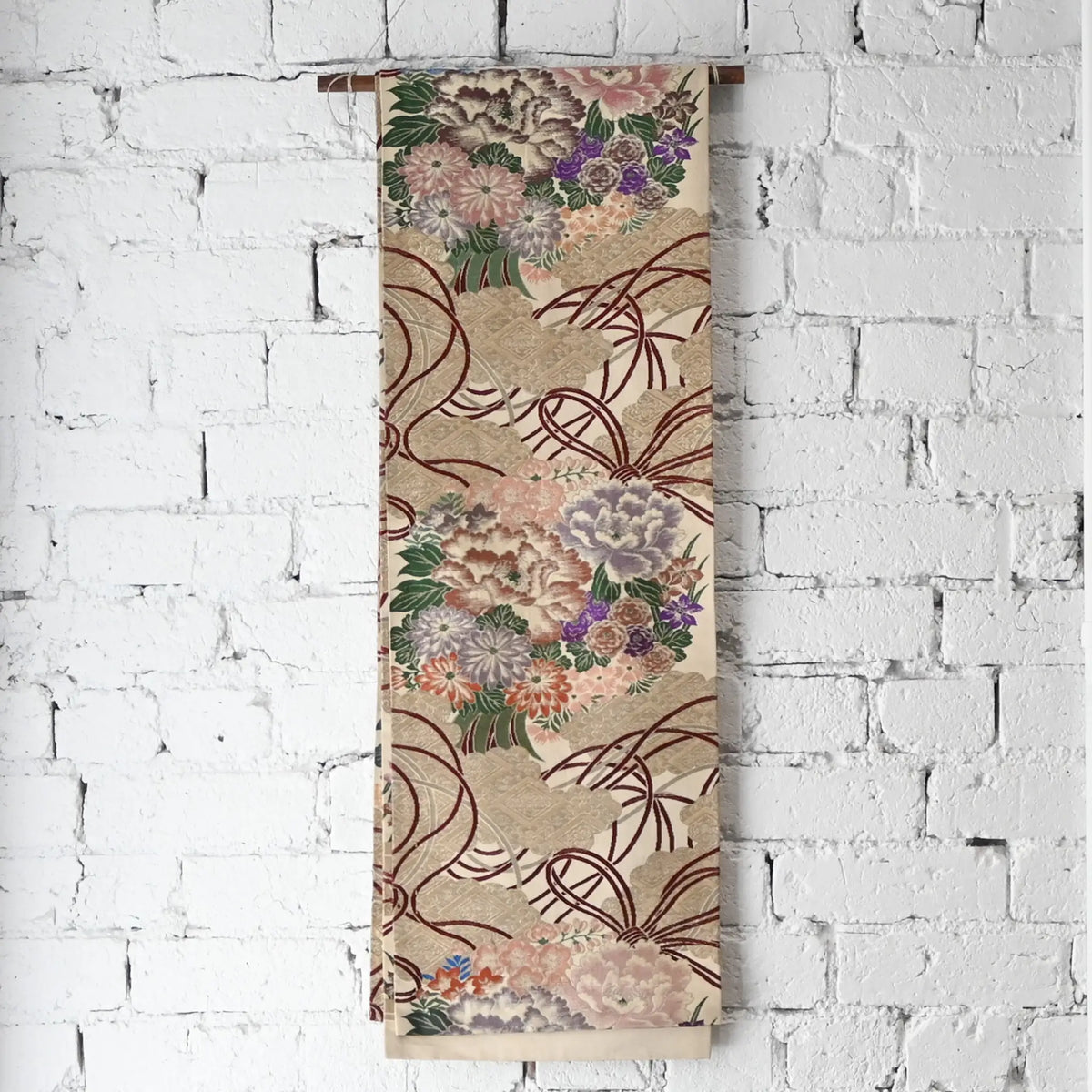 Hanging view of antique silk Maru obi with floral bouquet motif from the early 20th century.