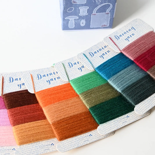Detailed view of Clover Japan darning yarn set, 24 different colours, perfect for mending.