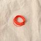 Authentic Japanese Hida sashiko threads in bright orange on calico cotton.