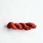 Authentic Japanese sashiko threads hank from Hida, Gifu, in terracotta.