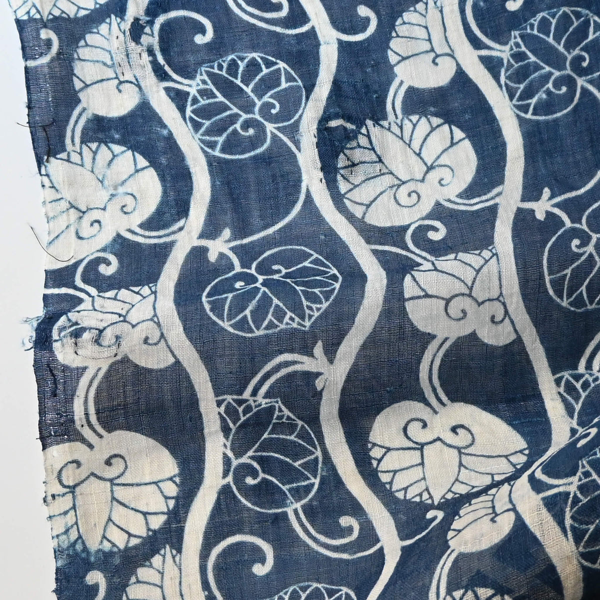 Close-up view of antique indigo katazome dyed hemp futon cover panel from the early 20th century, Aoi leaves with Yoroke stripes.