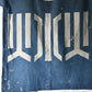 Detailed view of rare vintage indigo cotton hanten, belonged to a local rescue organization that assisted people during floods and fires.