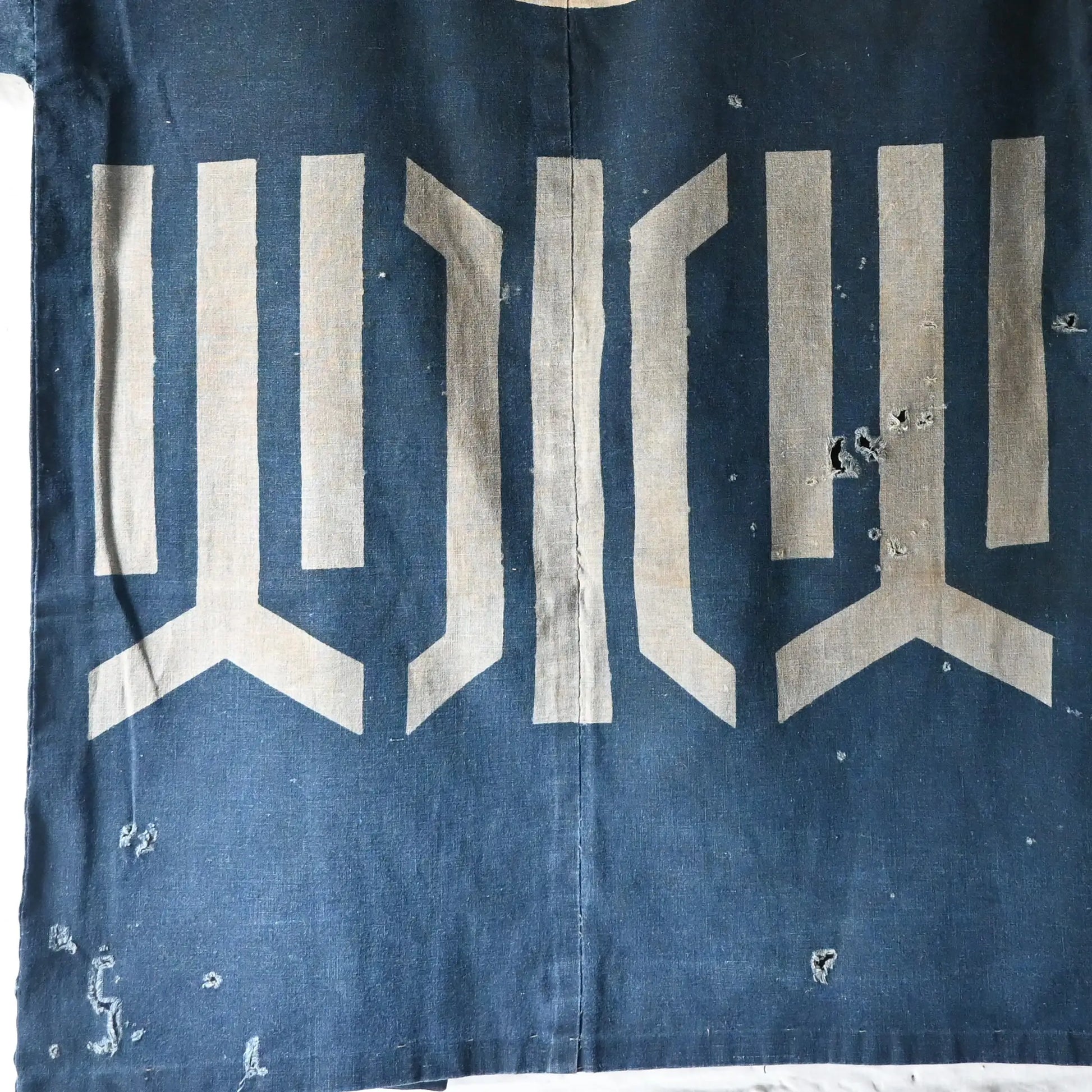 Detailed view of rare vintage indigo cotton hanten, belonged to a local rescue organization that assisted people during floods and fires.