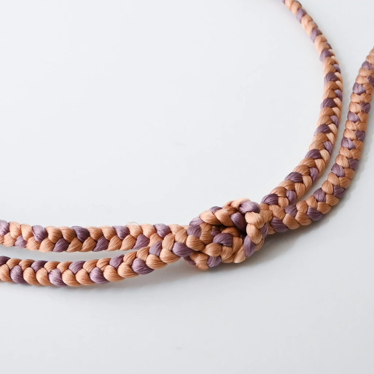Recycled silk braided obijime cord in soft pink and purple.