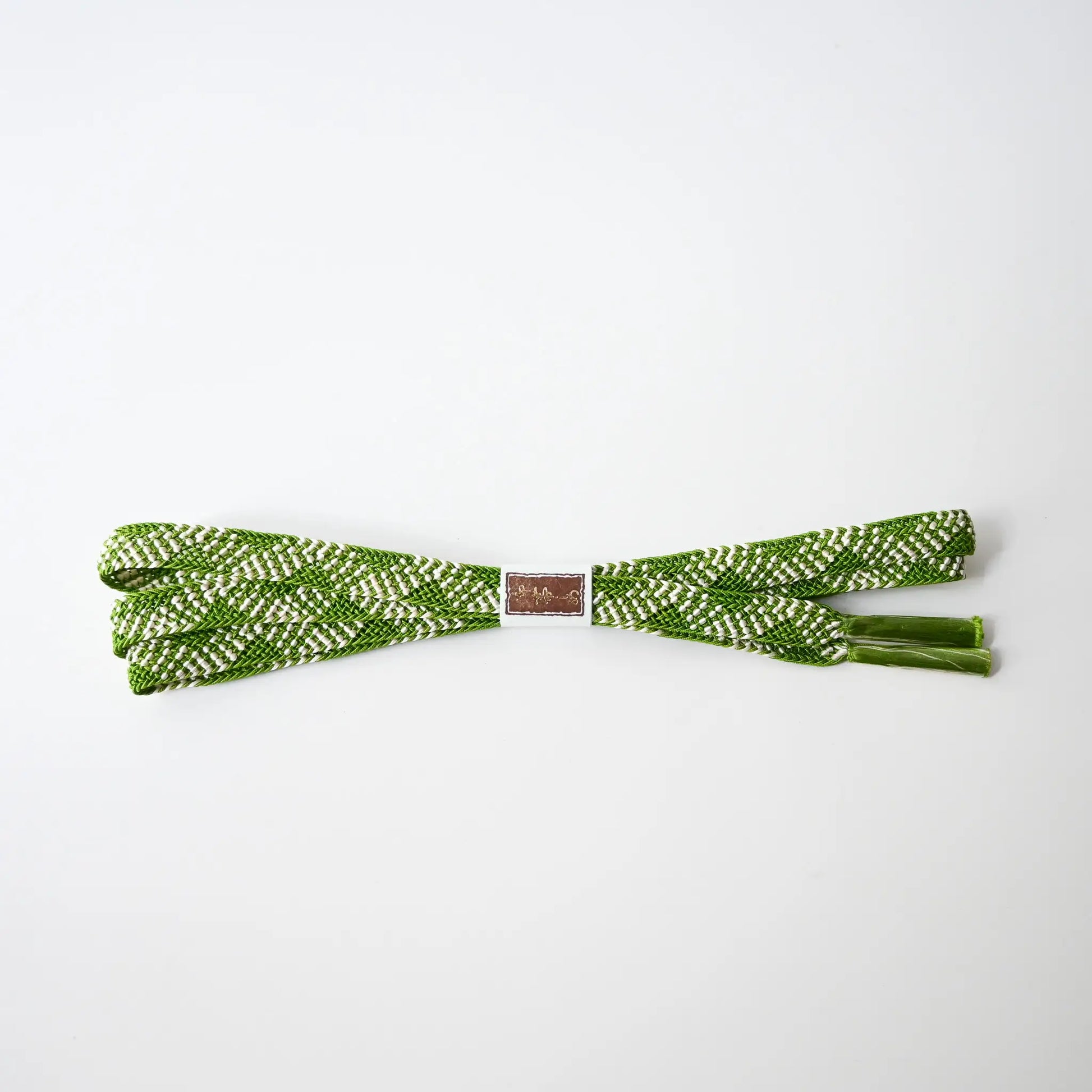 Recycled silk obijime in a fresh matcha green with white accent.