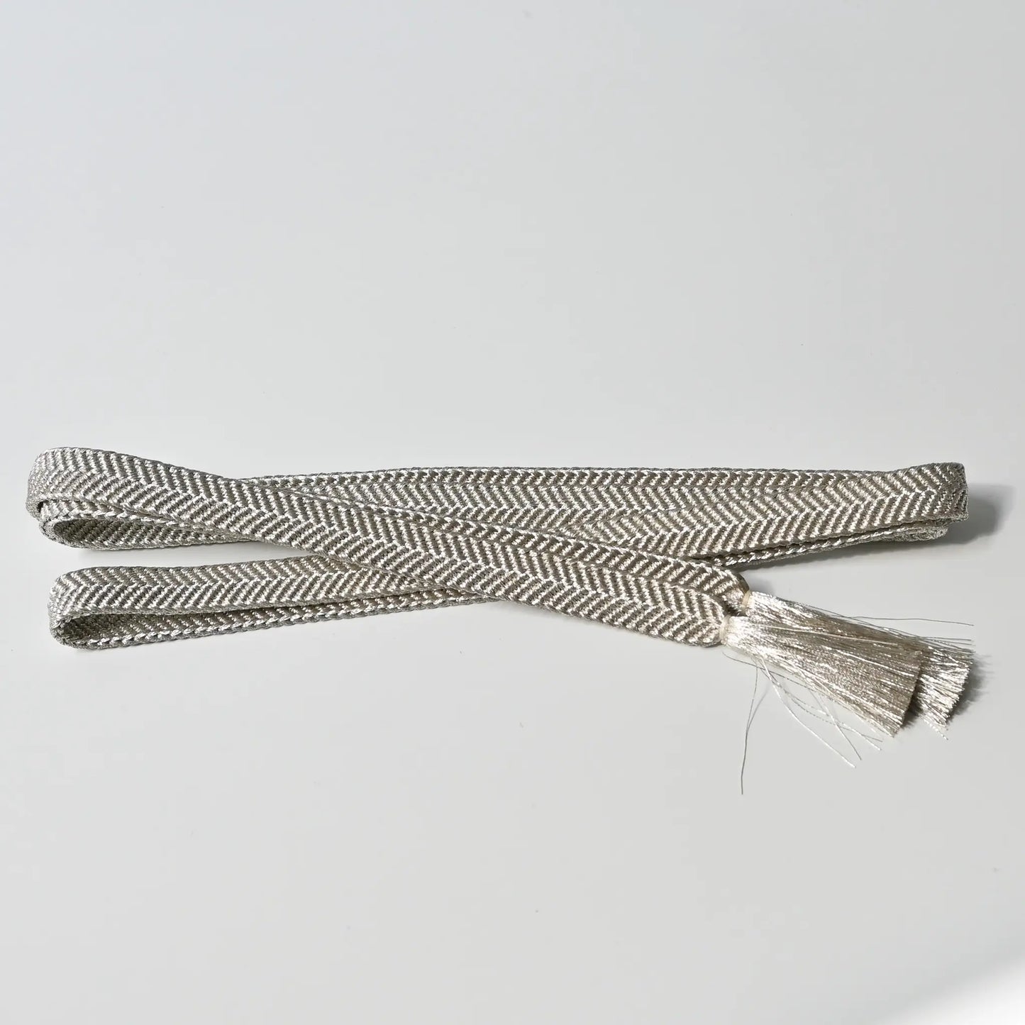 Vintage/recycled women's kimono dress accessories, Obijime cord in metallic silver.